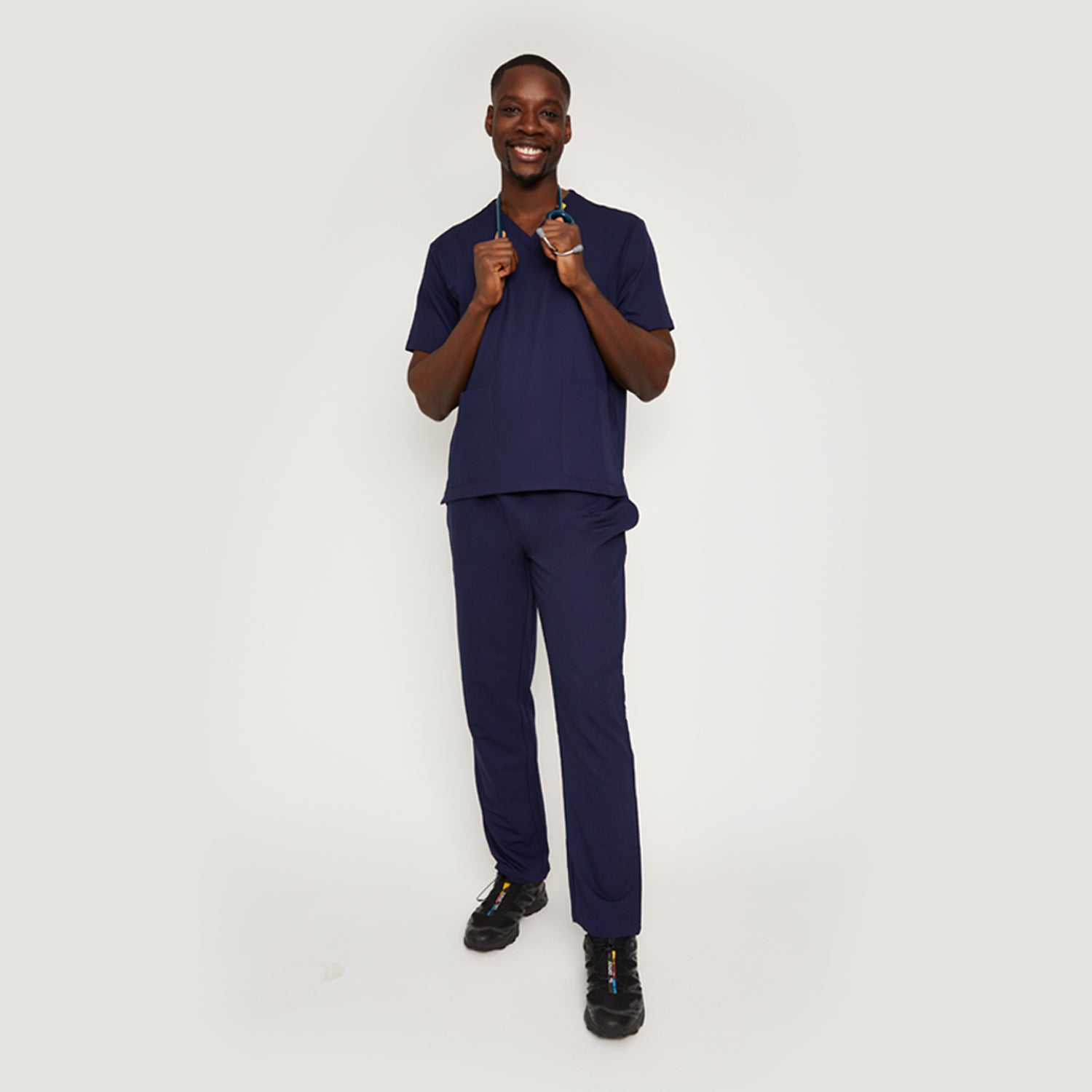 Nimbs medical scrubs in navy dark blue, available in the UK, featuring our signature yellow tag for healthcare professionals.